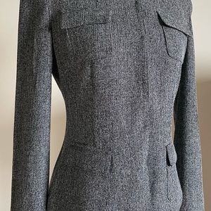Beautiful Tahari blazer, size 4. Tapered fit.